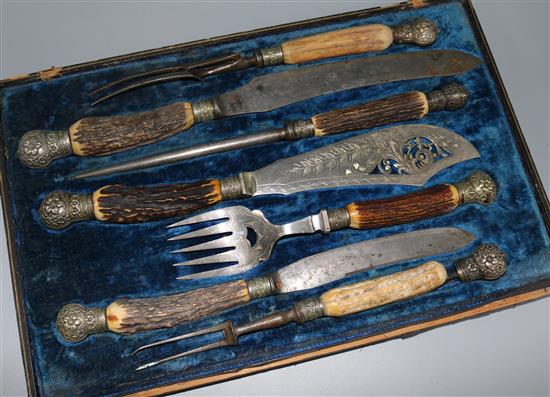 A late Victorian five piece antler horn handled plated carving set and a pair of similar fish servers, in case.